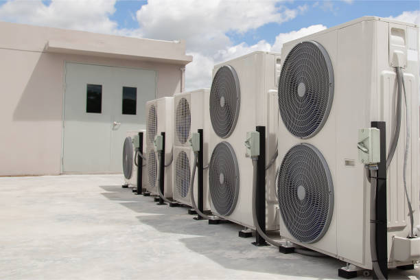 Row of commercial air conditioning units installed on a rooftop
