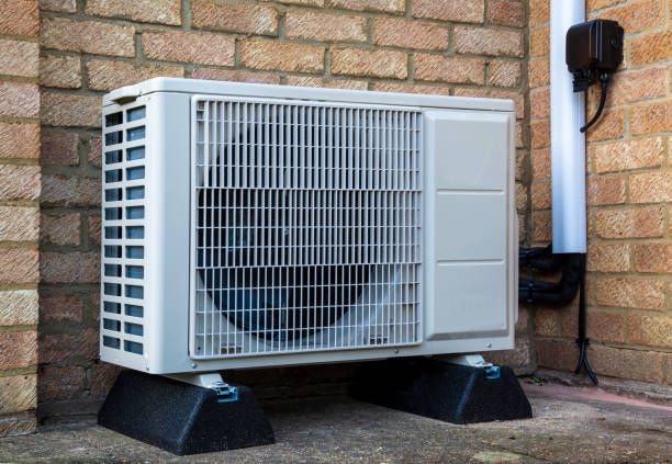Outdoor condenser unit installed on an exterior wall