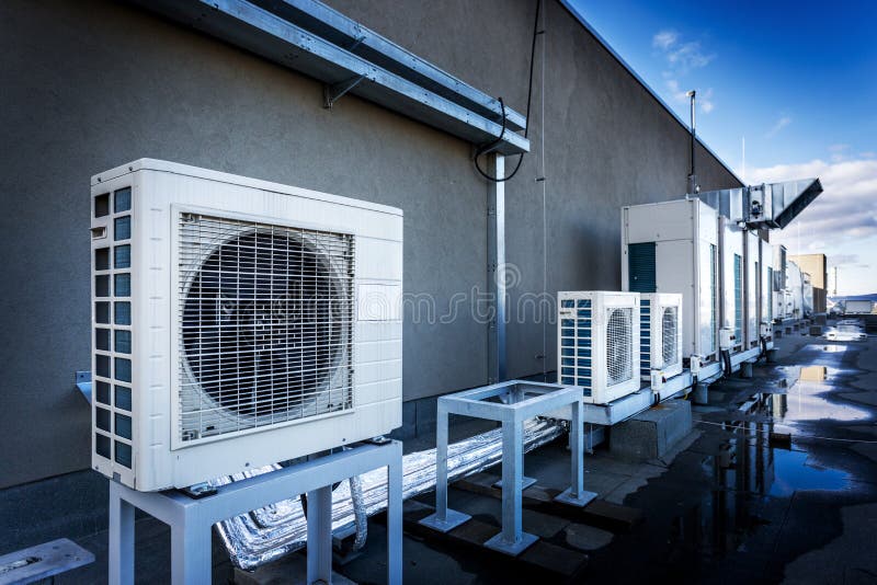 Rooftop air conditioning units mounted on concrete plinths